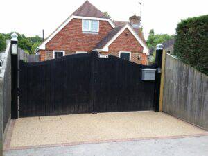 a black fence in front of a house